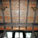 Playroom Ceiling with tongue and groove wood ceiling and heavy cedar beams