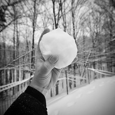 Architect throwing a snowball
